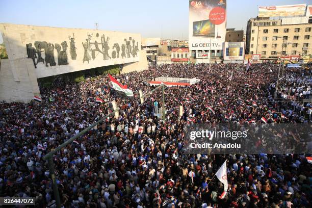 Supporters of Iraqi Shiite cleric Moqtada al-Sadr attend a demonstration against the new electoral bill of the country, prepared for the upcoming...