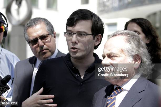 Martin Shkreli, former chief executive officer of Turing Pharmaceuticals AG, center, speaks to members of the media with his attorney Benjamin...