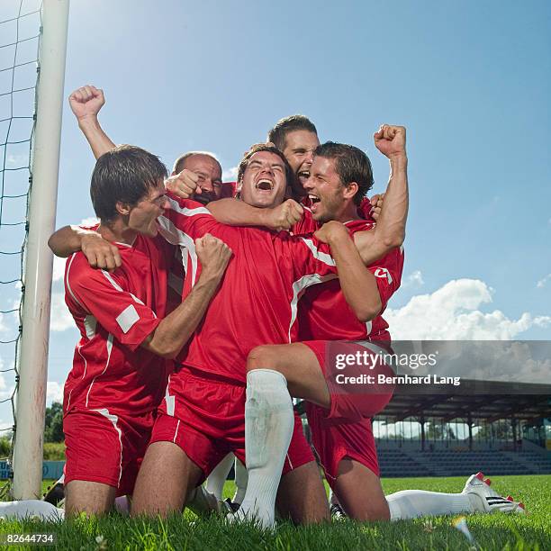 five soccer player celebrating  - football player kneeling stock pictures, royalty-free photos & images