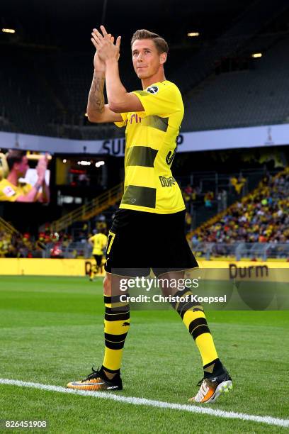 Erik Durm welcomes the fans during the Borussia Dortmund Season Opening 2017/18 at Signal Iduna Park on August 4, 2017 in Dortmund, Germany.