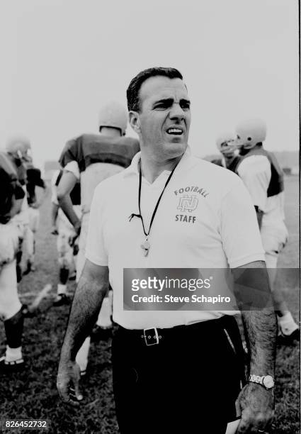 View of American college football coach Ara Parseghian , of the University of Notre Dame, on the field during a team practice, South Bend, Indiana,...