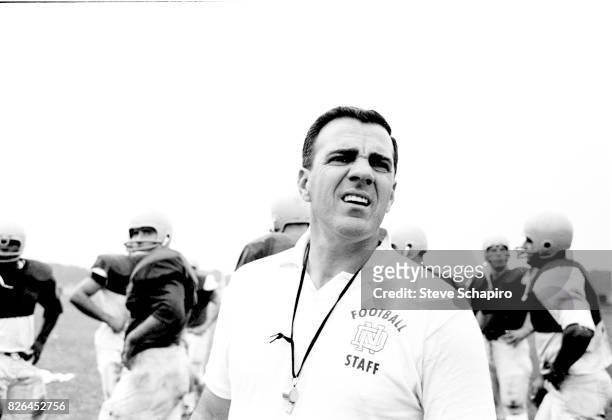 View of American college football coach Ara Parseghian , of the University of Notre Dame, on the field during a team practice, South Bend, Indiana,...