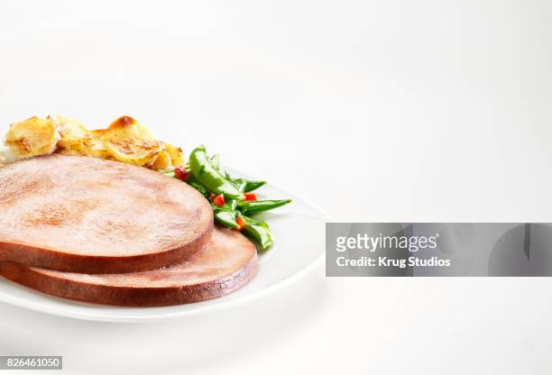 toupie ham with scalloped potatoes and green beans - toupie stock pictures, royalty-free photos & images