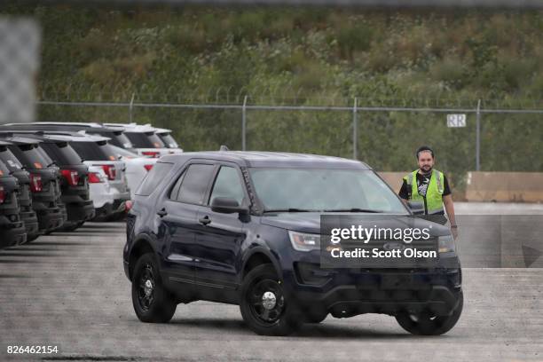 Ford Explorer based Police Interceptors sit in a parking lot of Troy Design and Manufacturing where they are outfitted to police department...