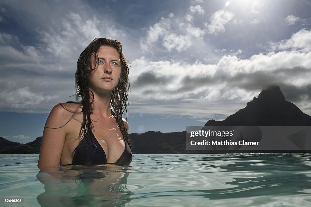 Portrait of young woman in water