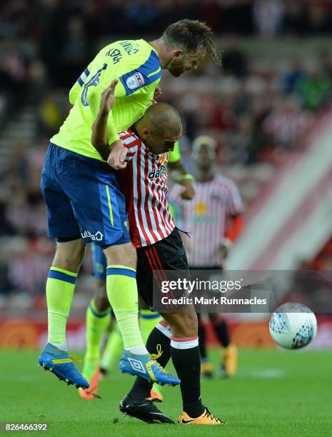 James Vaughan of Sunderland is challenged by Richard Keogh of Derby County during the Sky Bet Championship match between Sunderland and Derby County...