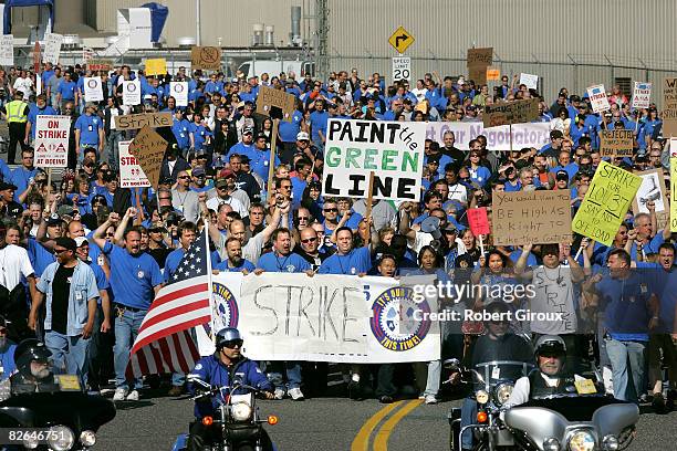 Boeing machinists march to their IAW Union local September 3, 2008 in Everett, Washington. The union members are heading to vote on two proposals one...