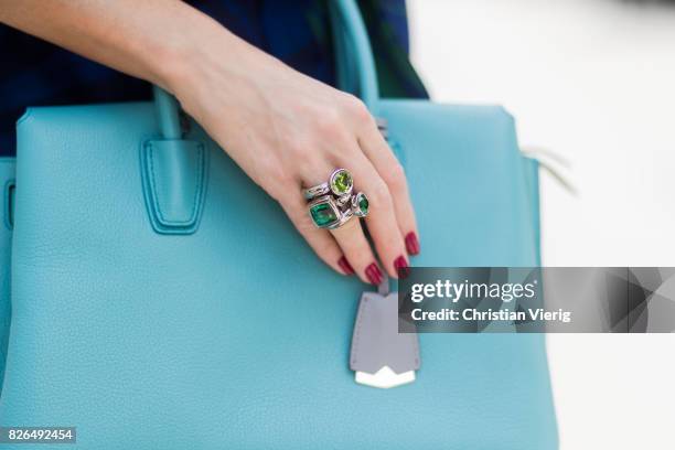 Model and fashion blogger Alexandra Lapp wearing a blue Kimono maxi dress with green leaf print from Borgo de Nor, green metallic Aviator sunglasses...