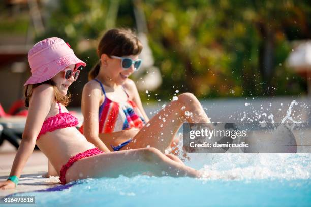 girls having fun in a swimming pool - waterpark stock pictures, royalty-free photos & images