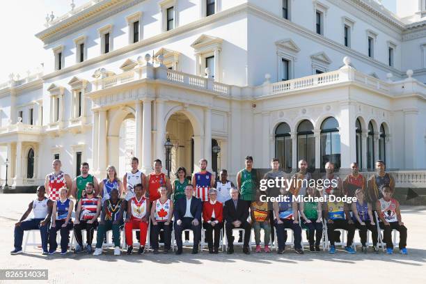 The Mens and Womens team captains pose together with Honourable Linda Dessau AC, Governor of Victoria, her husnand Tony Howard and John Eren, Sport...