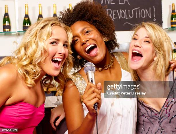 girls night out karaoke party - woman binge drinking stock pictures, royalty-free photos & images