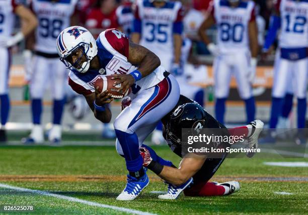 Montreal Alouettes quarterback Darian Durant attempts to avoid being sacked during Canadian Football League action between Montreal Alouettes and...