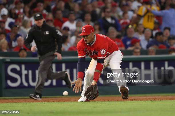 Yunel Escobar of the Los Angeles Angels of Anaheim fields a ground ball to third during the third inning of the MLB game against the Los Angeles...