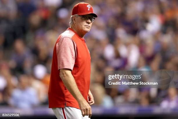 Manager Pete Mackanin of the Philadelphia Phillies walks back to the dugout after changing pitchers in the seventh inning against the Colorado...