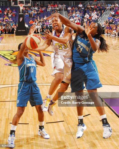 Cappie Pondexter of the Phoenix Mercury shoots against Nicky Anosike of the Minnesota Lynx at U.S. Airways Center September 3, 2008 in Phoenix,...