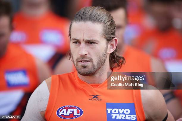 Callan Ward of the Giants walks through the race during the round 20 AFL match between the Greater Western Sydney Giants and the Melbourne Demons at...