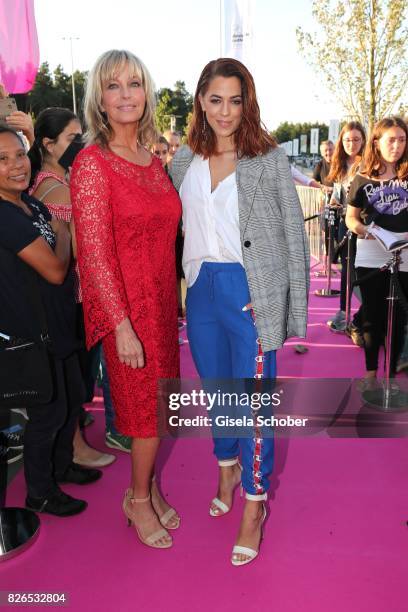 Bo Derek, wearing a red dress by Minx and Vanessa Mai during the late night shopping at Designer Outlet Soltau on August 4, 2017 in Soltau, Germany.