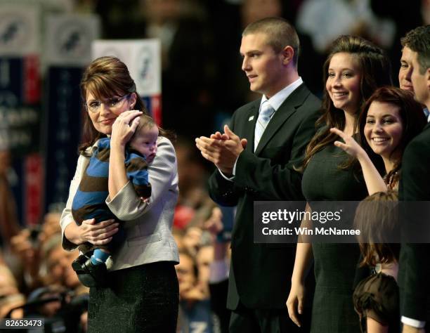 Republican U.S vice-presidential nominee Alaska Gov. Sarah Palin holds her son Trig Palin as Track Palin, Bristol Palin and Willow Palin look on...