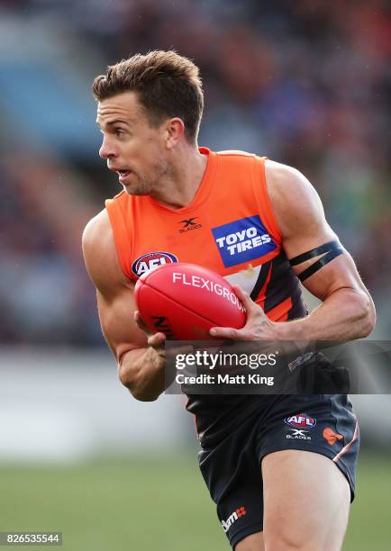 Brett Deledio of the Giants carries the ball during the round 20 AFL match between the Greater Western Sydney Giants and the Melbourne Demons at UNSW...