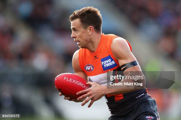 Brett Deledio of the Giants carries the ball during the round 20 AFL match between the Greater Western Sydney Giants and the Melbourne Demons at UNSW...