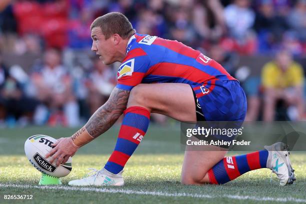 Trent Hodkinson of the Knights lines up for a kick during the round 22 NRL match between the Newcastle Knights and the New Zealand Warriors at...