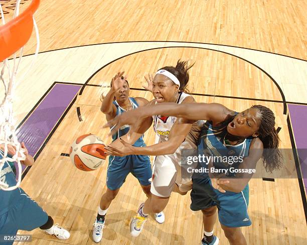 Cappie Pondexter of the Phoenix Mercury shoots against Nicky Anosike of the Minnesota Lynx at U.S. Airways Center September 3, 2008 in Phoenix,...