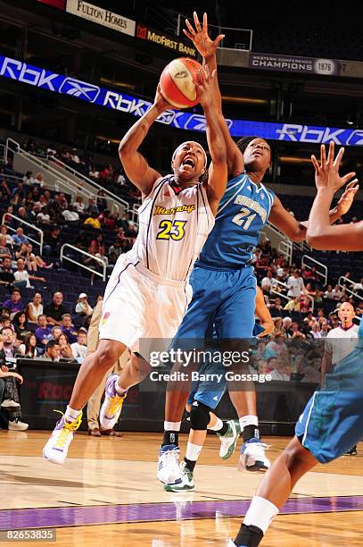 Cappie Pondexter of the Phoenix Mercury shoots against Nicky Anosike of the Minnesota Lynx at U.S. Airways Center September 3, 2008 in Phoenix,...