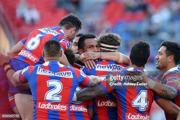 Knights players celebrate a try from Lachlan Fitzgibbon during the round 22 NRL match between the Newcastle Knights and the New Zealand Warriors at...