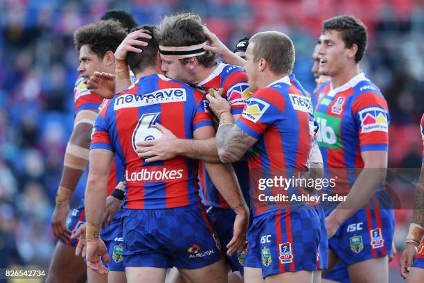 Knights players celebrate a try from Lachlan Fitzgibbon during the round 22 NRL match between the Newcastle Knights and the New Zealand Warriors at...