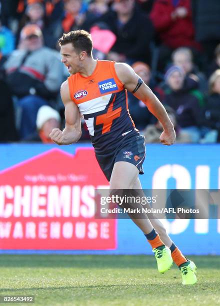 Brett Deledio of the Giants celebrates his first goal during the round 20 AFL match between the Greater Western Sydney Giants and the Melbourne...