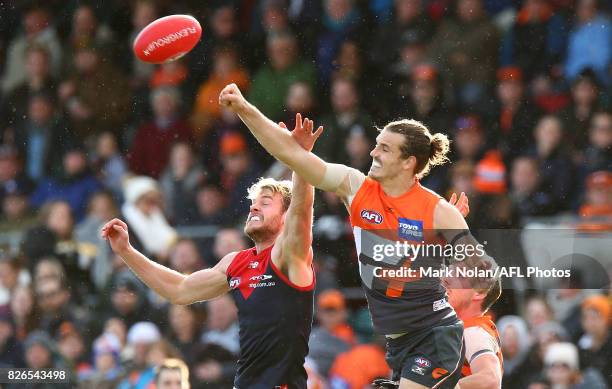 Jack Watts of the Demons and Phil Davis of the Giants contest a mark during the round 20 AFL match between the Greater Western Sydney Giants and the...