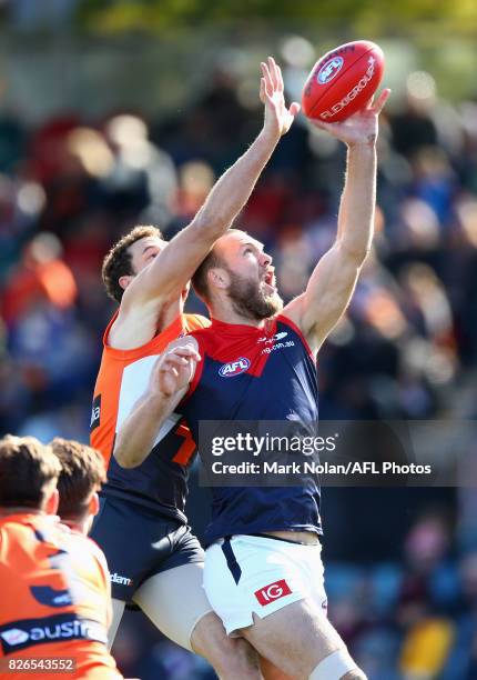Shane Mumford of the Giants and Max Gawn of the Demons contest possession during the round 20 AFL match between the Greater Western Sydney Giants and...