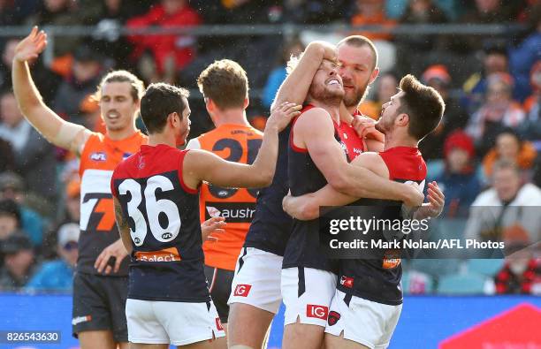 The Dmoans celebrate a goal by Alex Neal-Bullen during the round 20 AFL match between the Greater Western Sydney Giants and the Melbourne Demons at...