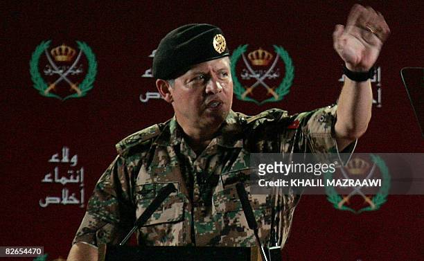 Jordan's King Abdullah II gestures as he addresses troops at a military base in Zarqa city near Amman late September 3, 2008. The Jordanian monarch...