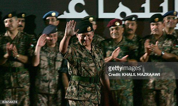 Jordan's King Abdullah II waves as he arrives to address troops at a military base in Zarqa city near Amman late September 3, 2008. The Jordanian...