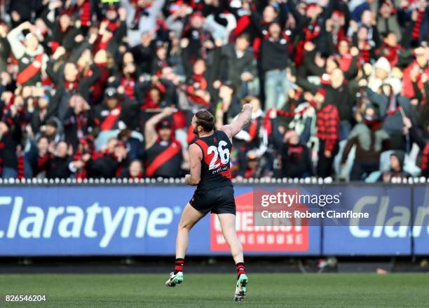 Cale Hooker of the Bombers celebrates after scoring a goal during the round 20 AFL match between the Essendon Bombers and the Carlton Blues at...