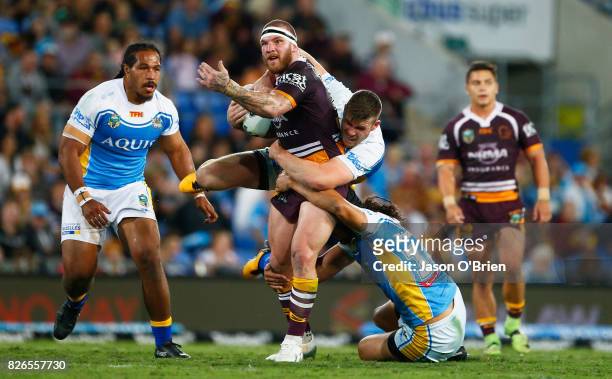 Josh McGuire of the Broncos runs with the ball during the round 22 NRL match between the Gold Coast Titans and the Brisbane Broncos at Cbus Super...