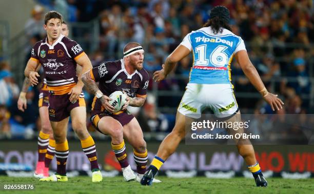 Josh McGuire of the Broncos runs with the ball during the round 22 NRL match between the Gold Coast Titans and the Brisbane Broncos at Cbus Super...