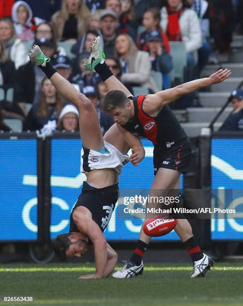 Levi Casboult of the Blues and Patrick Ambrose of the Bombers compete for the ball during the 2017 AFL round 20 match between the Essendon Bombers...