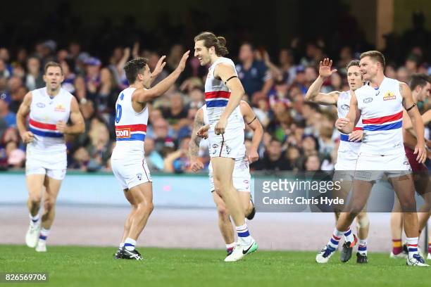 Marcus Bontempelli of the Bulldogs celebrates a goal during the round 20 AFL match between the Brisbane Lions and the Western Bulldogs at The Gabba...