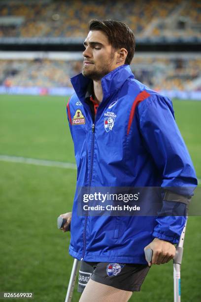 Easton Wood of the Bulldogs on crutches after an injury during the round 20 AFL match between the Brisbane Lions and the Western Bulldogs at The...