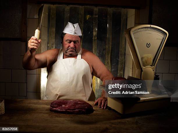 butcher chopping meat at counter - cleaver stock pictures, royalty-free photos & images