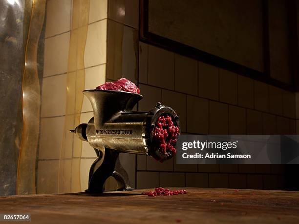 traditional mincer oozing with red meat - force meat stock pictures, royalty-free photos & images