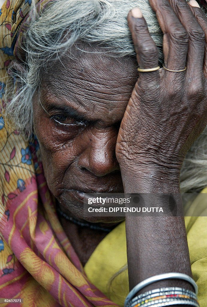 Maya Rany Indian flood-affected villager Maya Rani cries as she is shifted to a ...