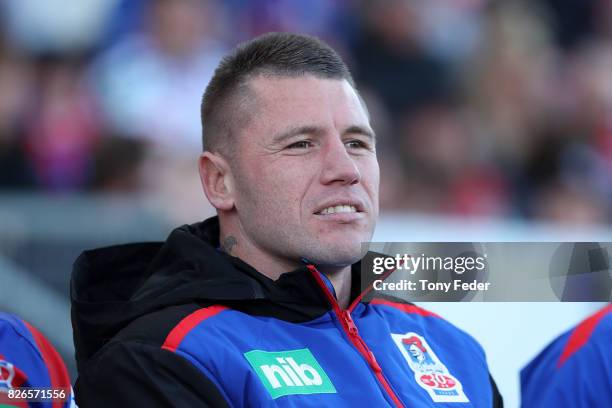 Shaun Kenny-Dowall of the Knights watches from the sideline during the round 22 NRL match between the Newcastle Knights and the New Zealand Warriors...