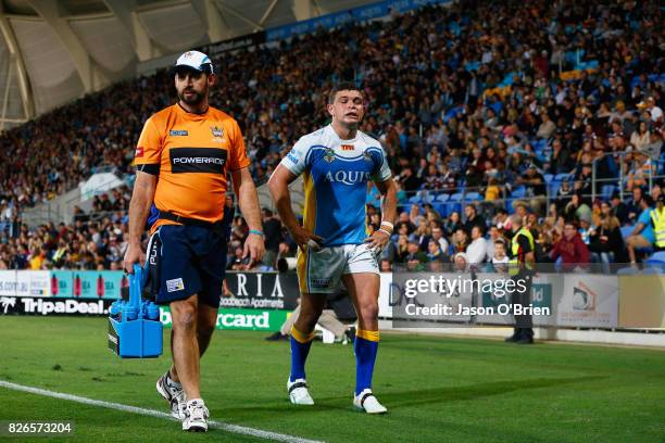 Ash Taylor of the titans looks dejected during the round 22 NRL match between the Gold Coast Titans and the Brisbane Broncos at Cbus Super Stadium on...