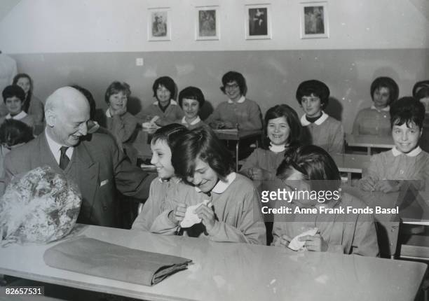 Otto Frank , father of Anne Frank visits a school in Bologna, Italy, April 1963. The pupils are about the age of his daughter Anne at the time of her...
