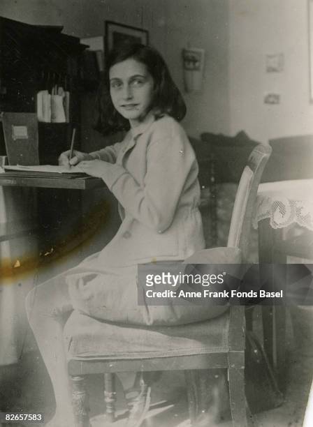 Anne Frank at her writing desk, 1941.