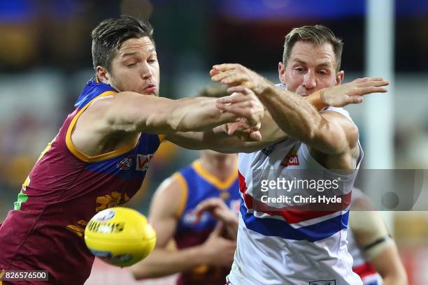 Stefan Martin of the Lions and Travis Cloke of the Bulldogs compete for the ball during the round 20 AFL match between the Brisbane Lions and the...
