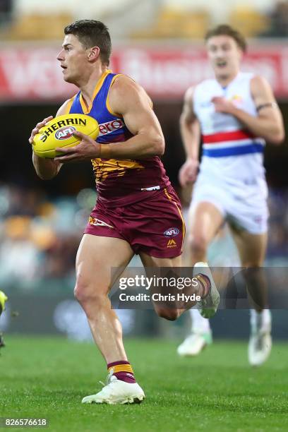 Dayne Zorko of the Lions handballs during the round 20 AFL match between the Brisbane Lions and the Western Bulldogs at The Gabba on August 5, 2017...